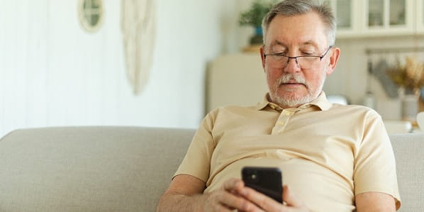 Man looking at phone - CROPPED